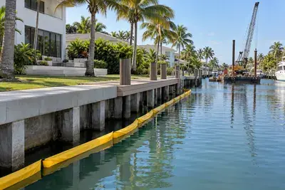 New concrete seawall cap and dock on a residential canal