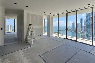 Empty condo unit under renovation with bay views