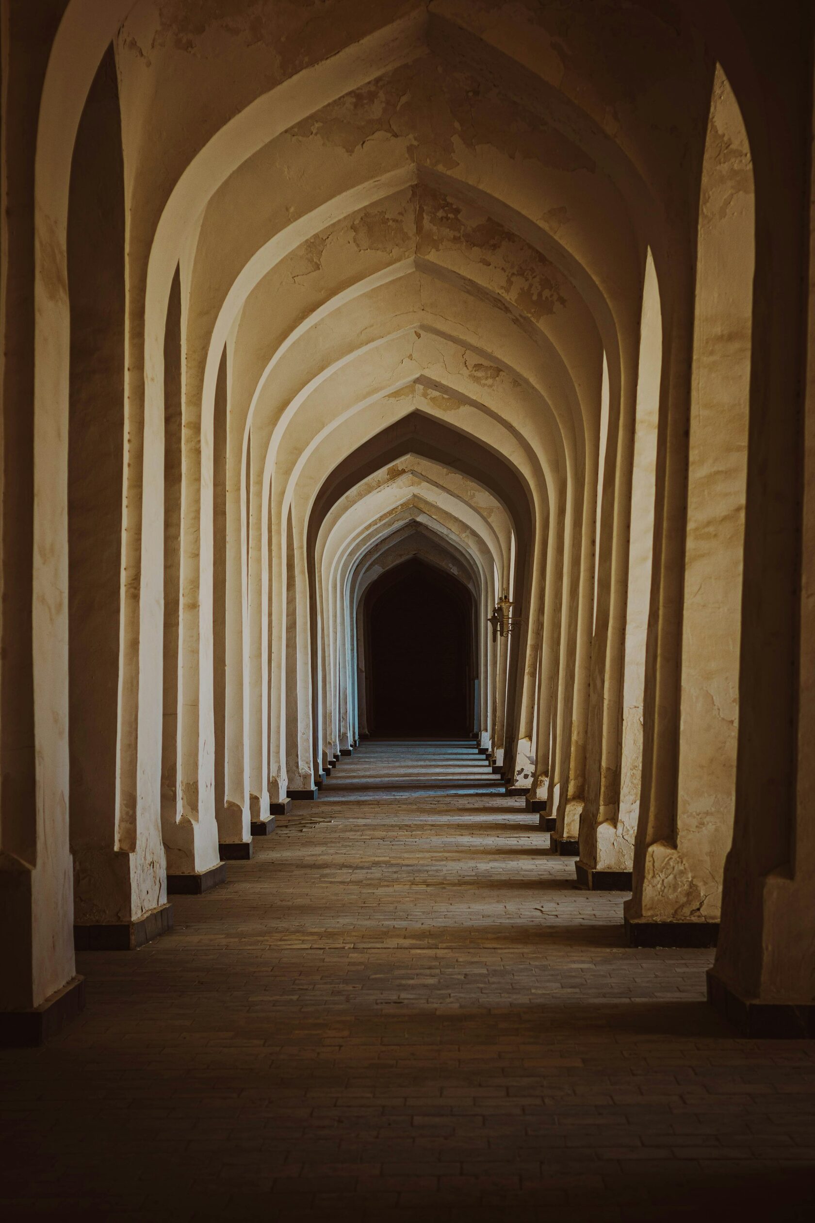 Arched passageway with warm stone columns