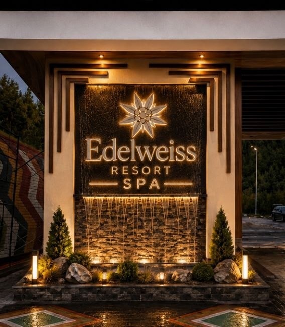Edelweiss Resort & Spa — illuminated entrance signage and water feature