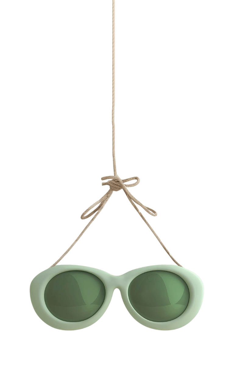 Зеленые солнечные очки, подвешенные на веревочке
