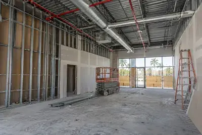 Retail space build-out with metal stud framing and an open ceiling