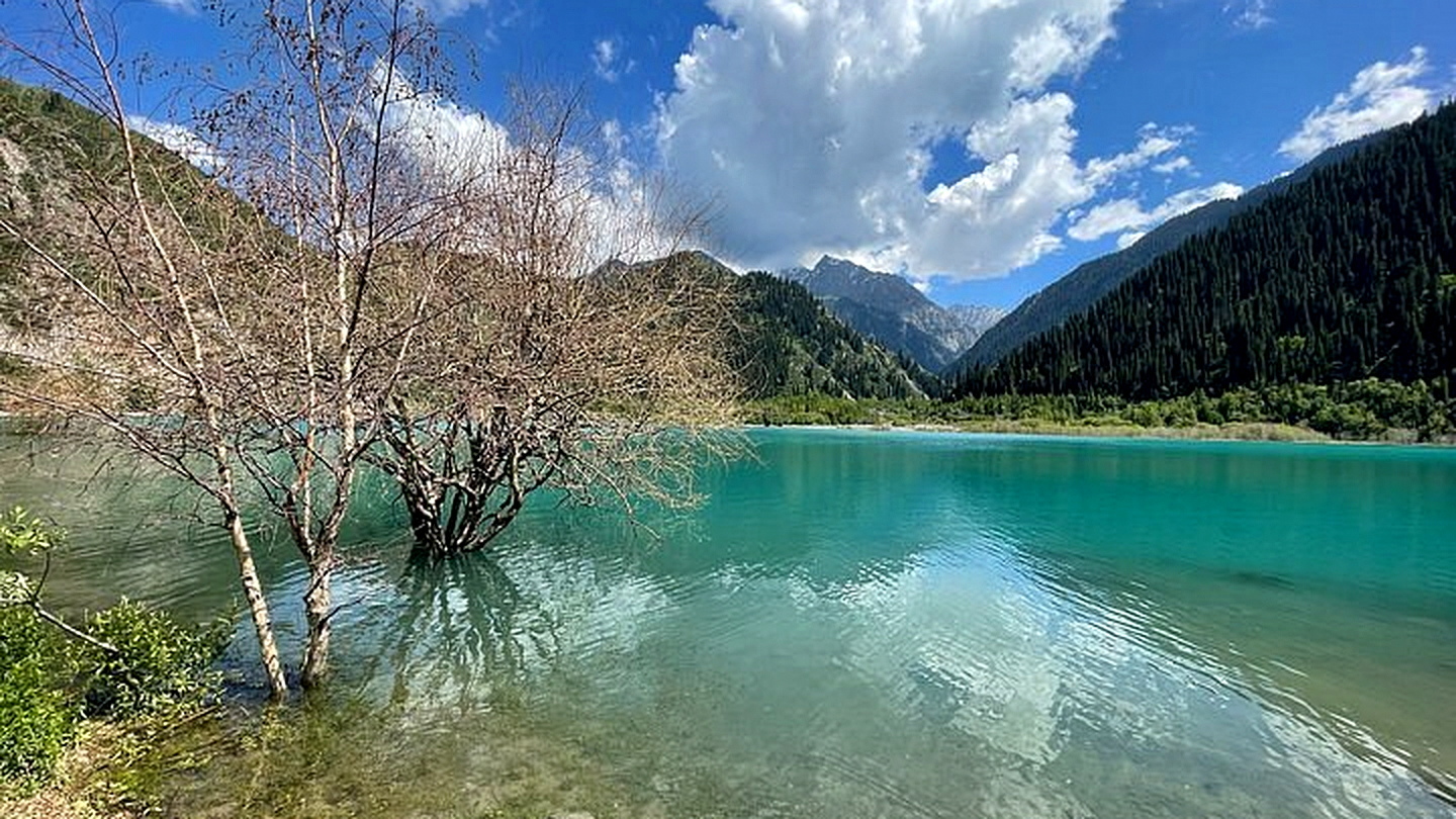 Turquoise Issyk Lake in a mountain gorge of the Almaty region