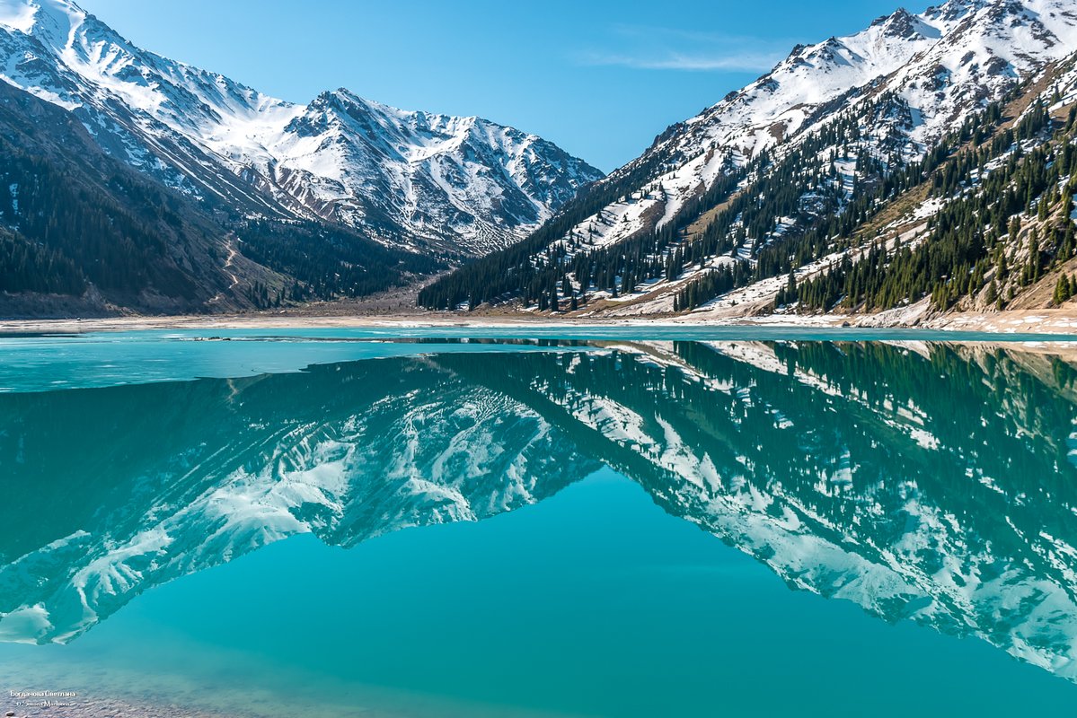 Big Almaty Lake surrounded by mountain peaks